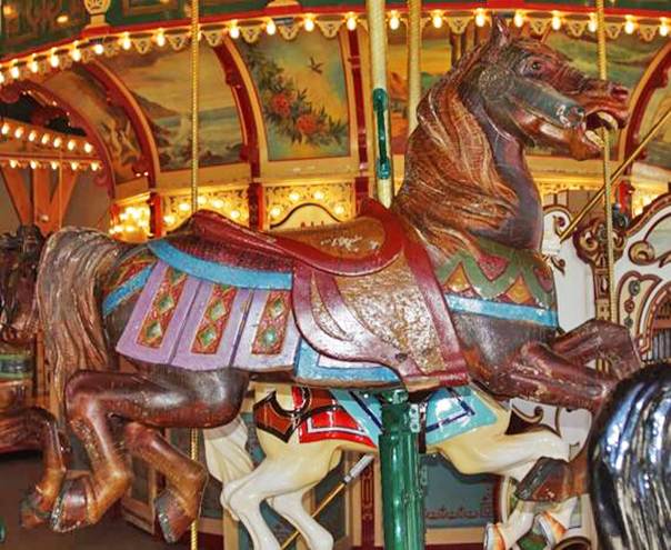 A carousel with horses on it
AI-generated content may be incorrect.