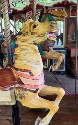 A carousel horse with a horse on it

AI-generated content may be incorrect.