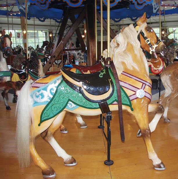 A carousel horse with saddles

Description automatically generated