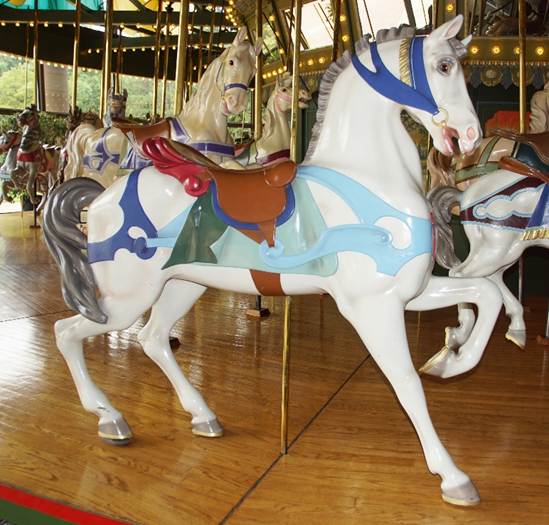 A picture containing carousel, outdoor object, ride, floor

Description automatically generated