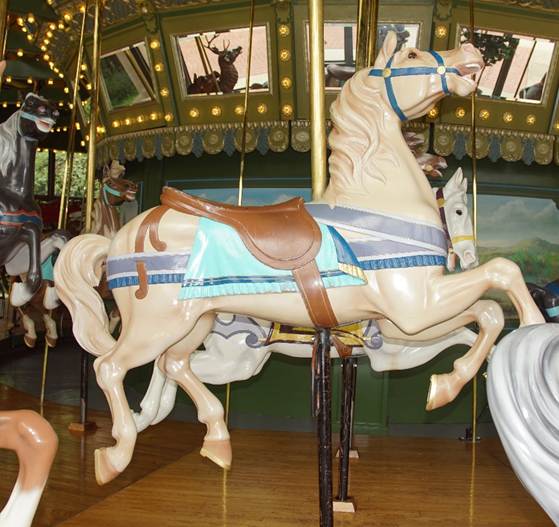 A picture containing carousel, outdoor object, ride, floor

Description automatically generated