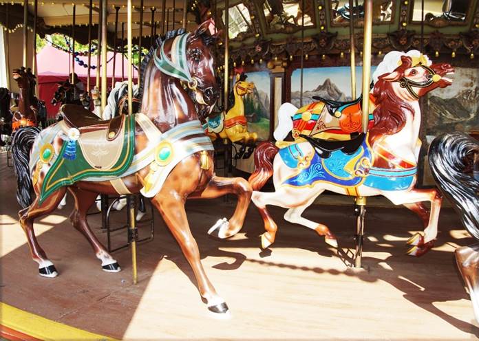 A horse on a merry go round

Description automatically generated