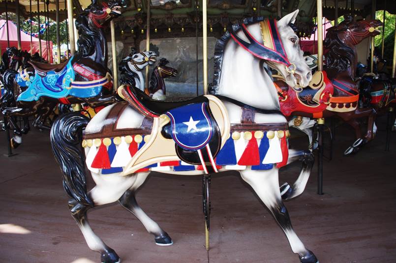 A horse on a merry go round

Description automatically generated