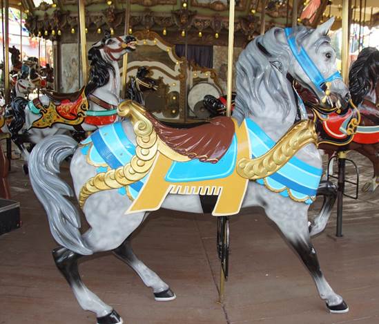 A horse on a merry go round

Description automatically generated