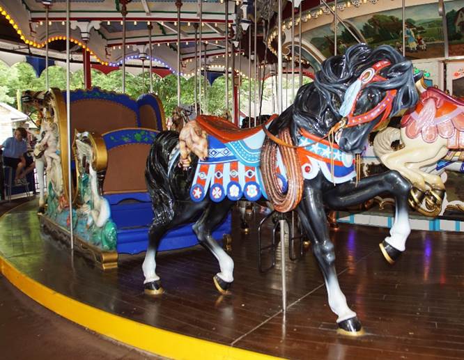 A horse on a merry go round

Description automatically generated