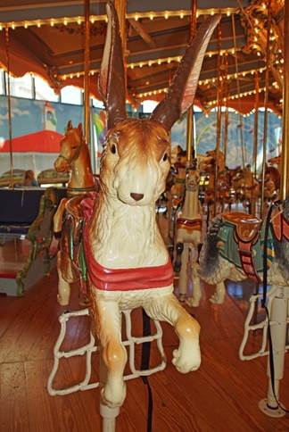 A picture containing carousel, outdoor object, ride, indoor

Description automatically generated