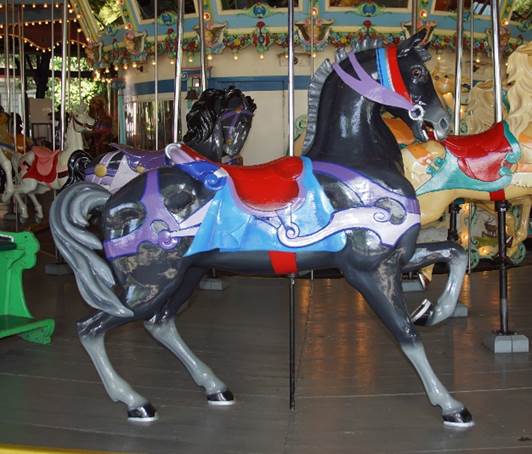 A horse on a merry go round

Description automatically generated