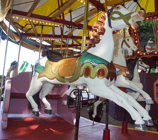 A close up of a carousel

Description automatically generated