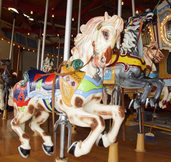 A picture containing carousel, ride, outdoor object, indoor

Description automatically generated