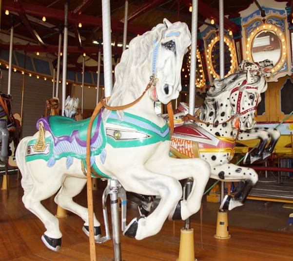 A picture containing carousel, ride, outdoor object, floor
Description automatically generated