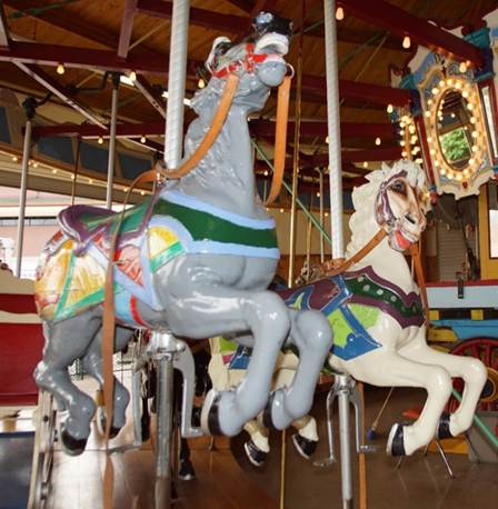A picture containing carousel, ride, indoor, outdoor object

Description automatically generated
