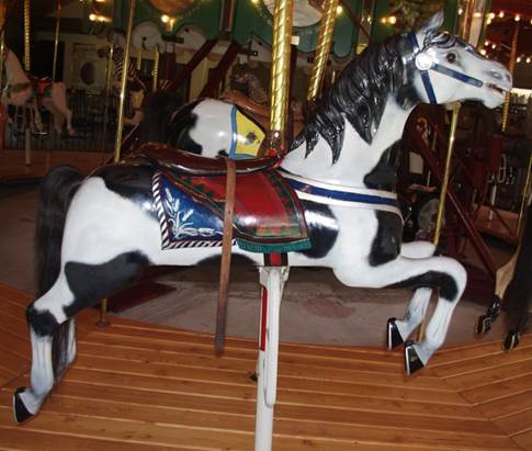 A white and brown horse

Description automatically generated