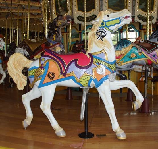 A picture containing carousel, floor, ride, outdoor object

Description automatically generated
