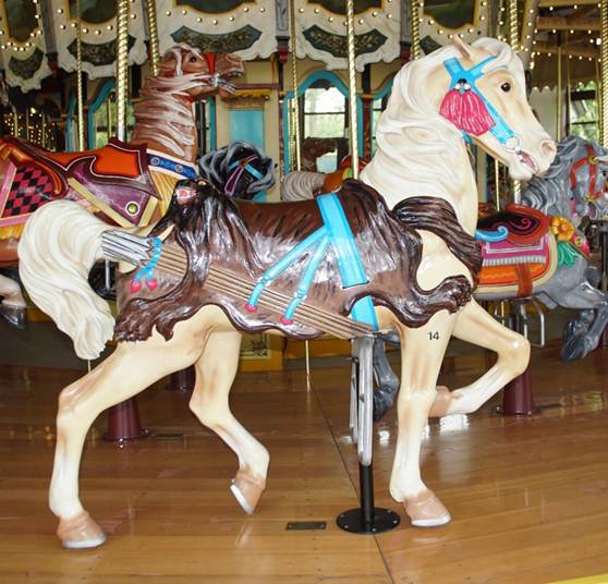 A picture containing floor, carousel, indoor, ride

Description automatically generated