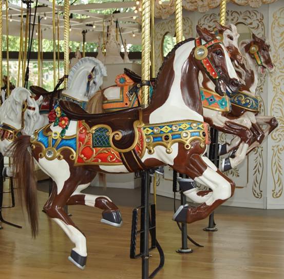 A picture containing carousel, floor, indoor, ride

Description automatically generated