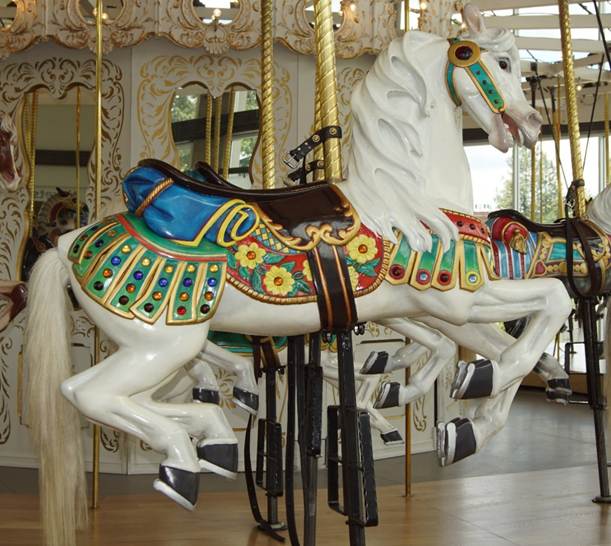 A chair sitting in front of a carousel
Description automatically generated