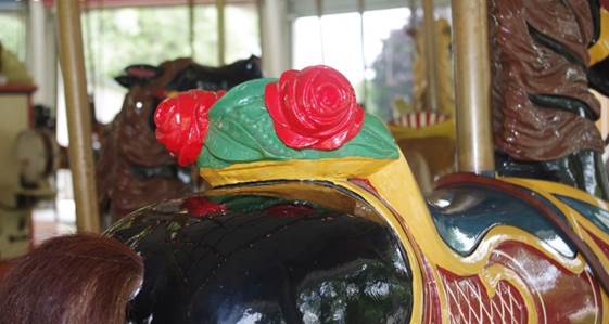 A close up of a carousel

Description generated with high confidence